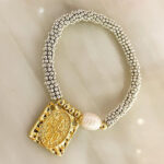 Pulsera balines escapulario Dorado