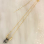 Collar mini cruz negra